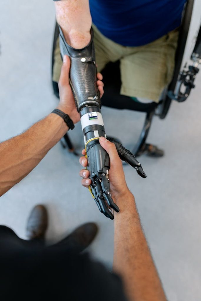 pexels-photo-3912979-1 Person Holding Prosthetic Arm